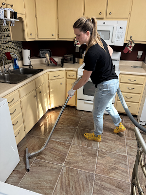 Water extraction equipment being used on a kitchen floor, shared by Leon Restoration Services
